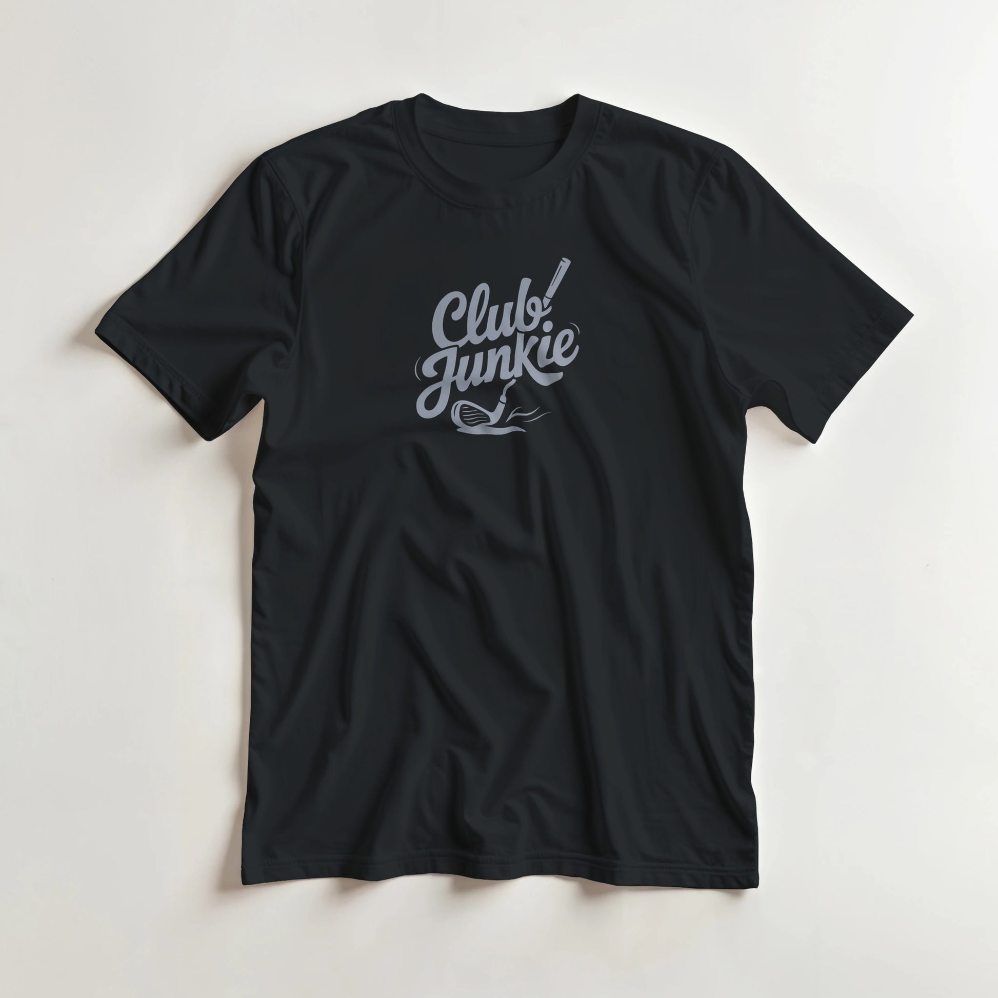 Club Junkie T-Shirt in Black S lying on a plain floor. T-shirt is a unisex cut and 100 per cent cotton.