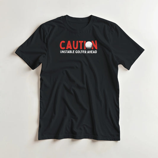 Unstable Golfer T-Shirt in Black lying on a plain floor. T-shirt is a unisex cut and 100 per cent cotton.