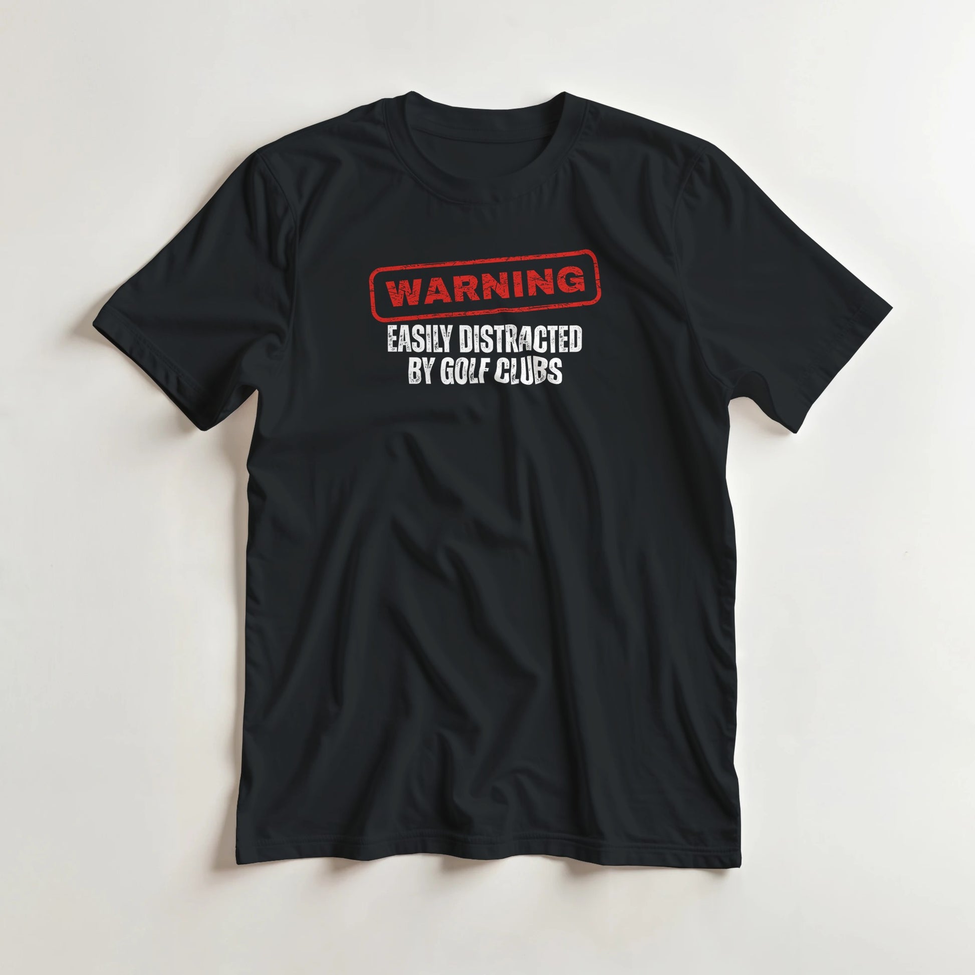 Warning T-Shirt in Black S lying on a plain floor. T-shirt is a unisex cut and 100 per cent cotton.