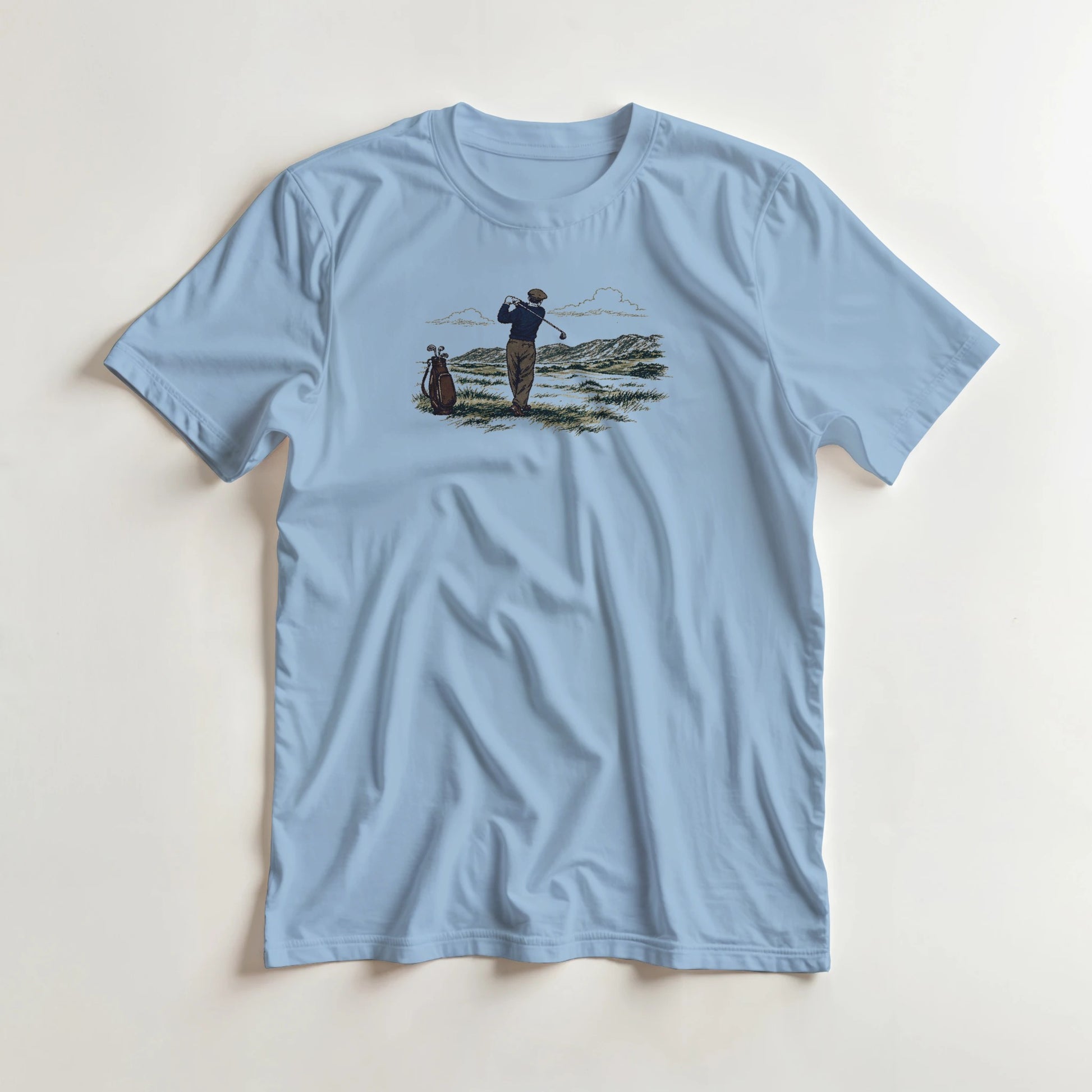 Brave Shot T-Shirt in Light Blue lying on a plain floor. T-shirt is a unisex cut and 100 per cent cotton.