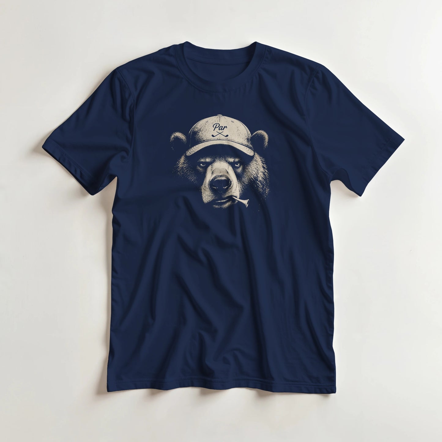 Bear Golfer T-Shirt in Navy lying on a plain floor. T-shirt is a unisex cut and 100 per cent cotton.