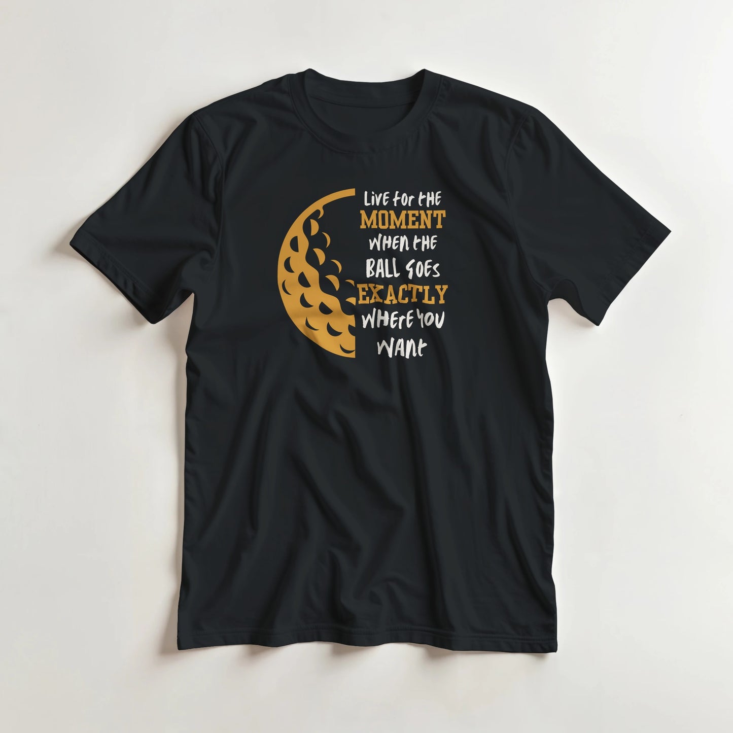 The Moment T-Shirt in Black lying on a plain floor. T-shirt is a unisex cut and 100 per cent cotton.