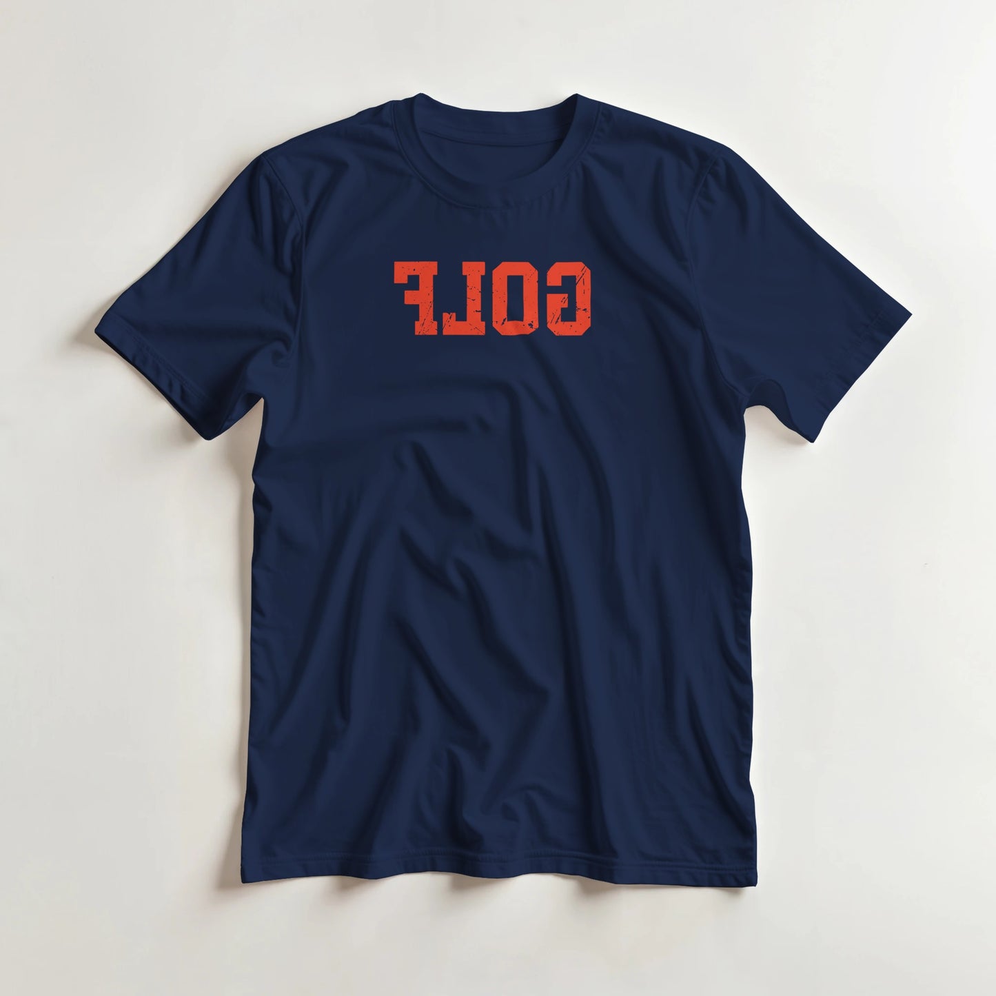 Golf Reverse T-Shirt in Navy M lying on a plain floor. T-shirt is a unisex cut and 100 per cent cotton.