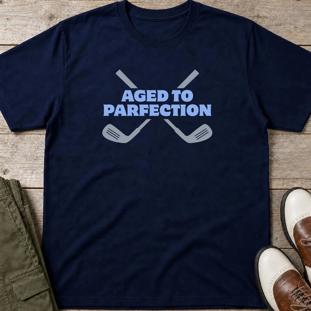 Parfection T-Shirt in Navy lying on a plain floor. T-shirt is a unisex cut and 100 per cent cotton.