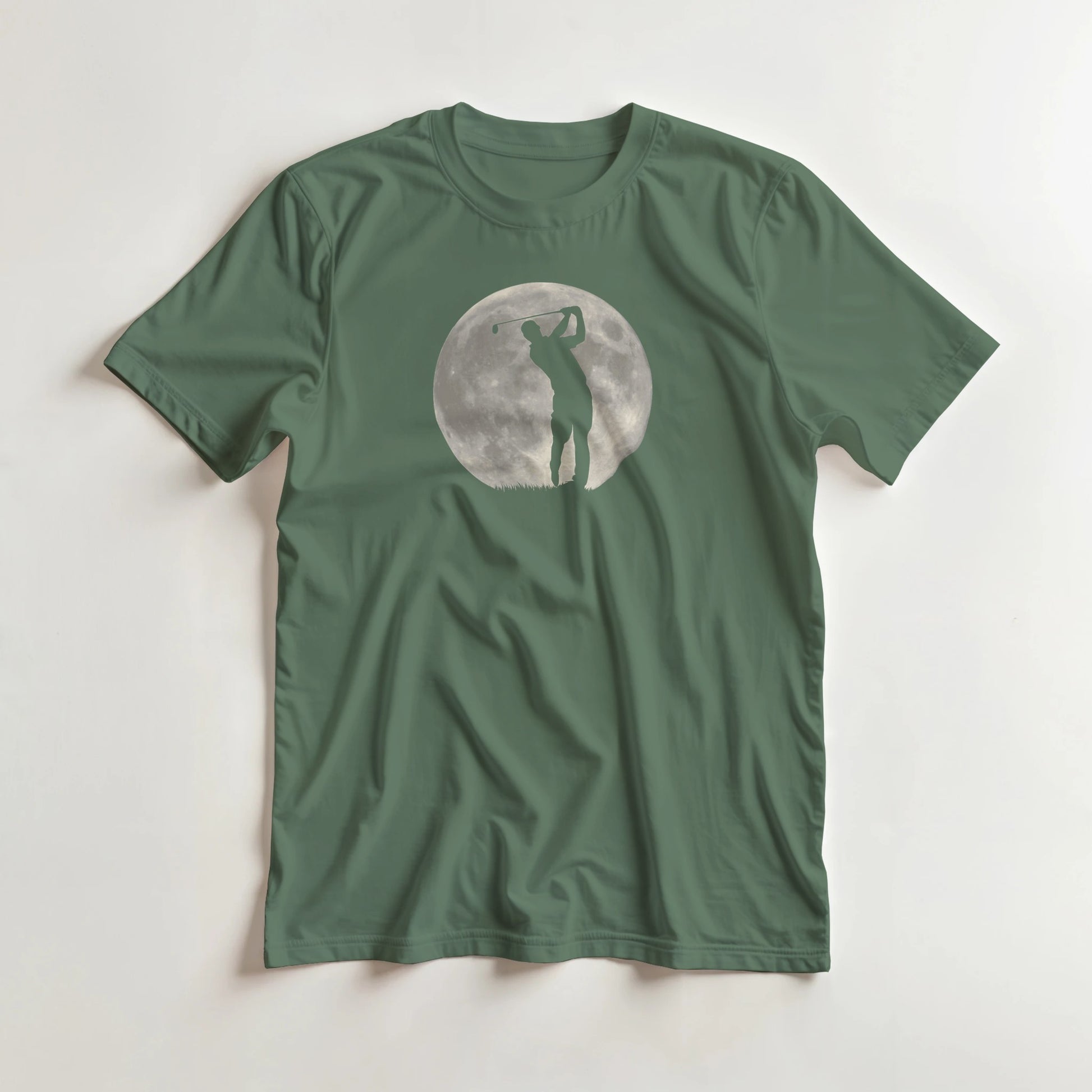 Moon Shot T-Shirt in Military Green S lying on a plain floor. T-shirt is a unisex cut and 100 per cent cotton.