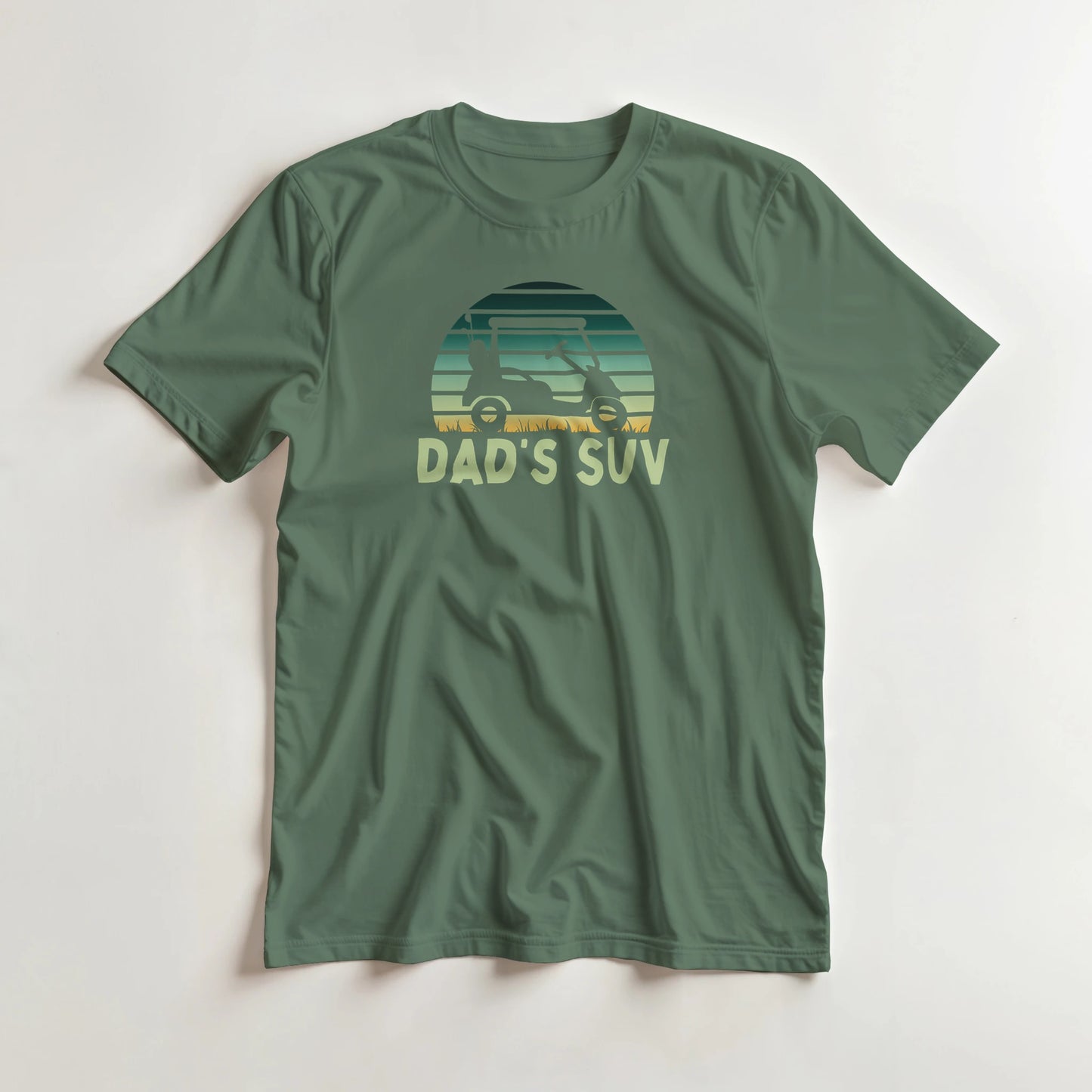 Dad's SUV T-Shirt in Military Green lying on a plain floor. T-shirt is a unisex cut and 100 per cent cotton.