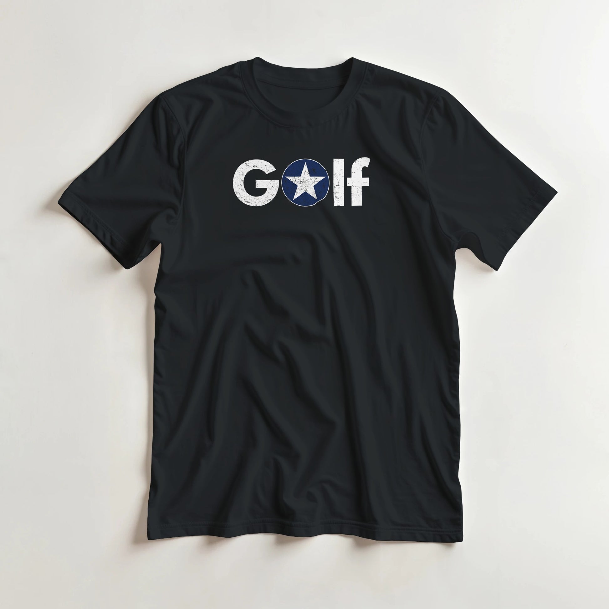 Golf Star T-Shirt in Black S lying on a plain floor. T-shirt is a unisex cut and 100 per cent cotton.