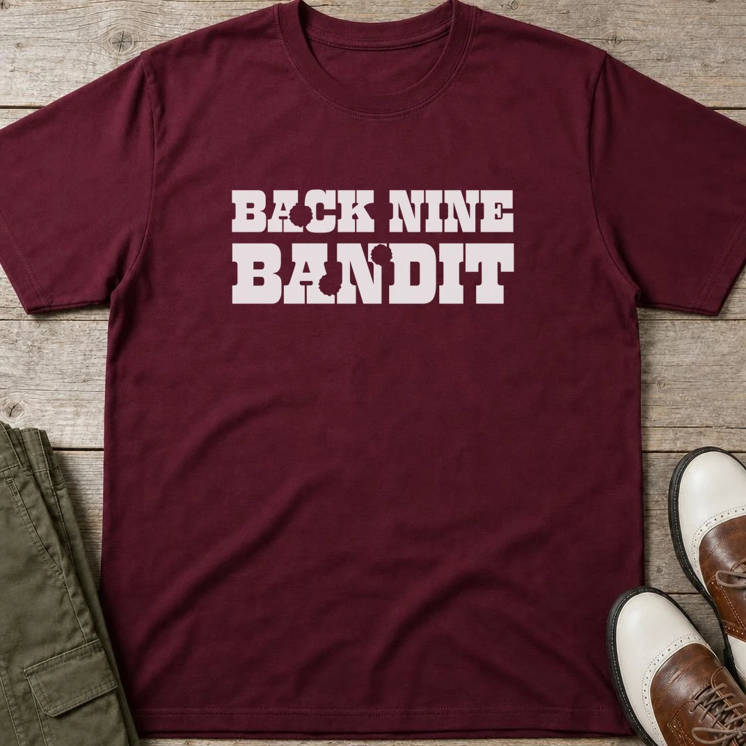 Bandit T-Shirt in Maroon lying on a plain floor. T-shirt is a unisex cut and 100 per cent cotton.