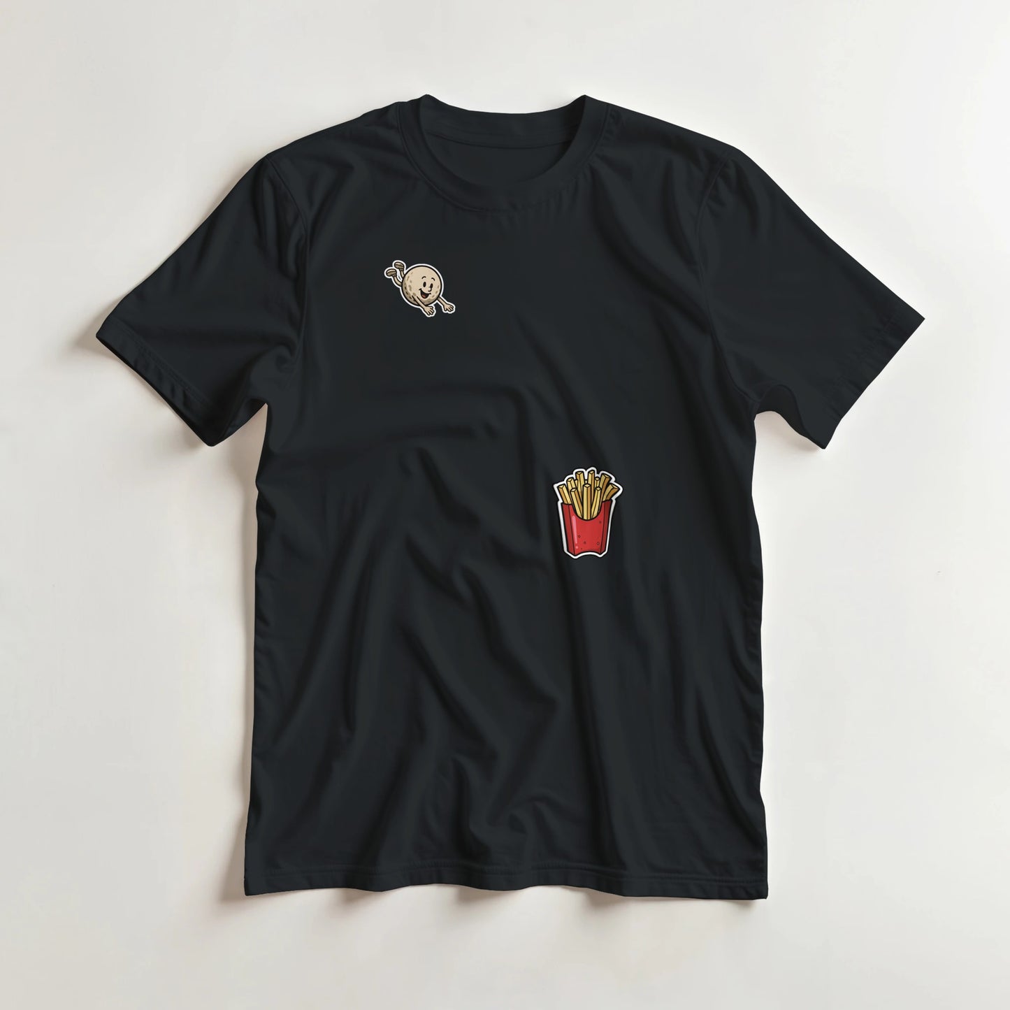 Flying Golf & Fries T-Shirt in Black lying on a plain floor. T-shirt is a unisex cut and 100 per cent cotton.
