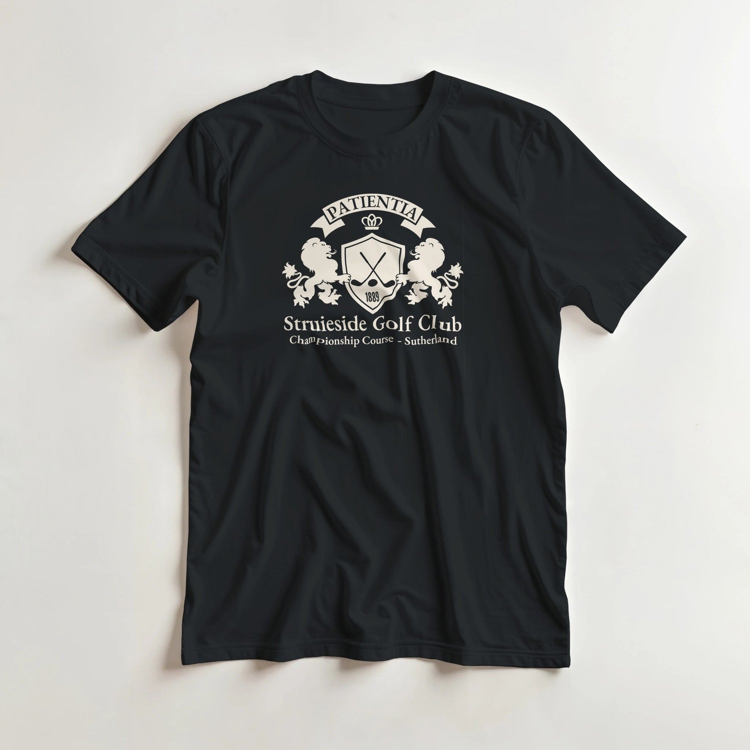 Struieside GC T-Shirt in Black lying on a plain floor. T-shirt is a unisex cut and 100 per cent cotton.