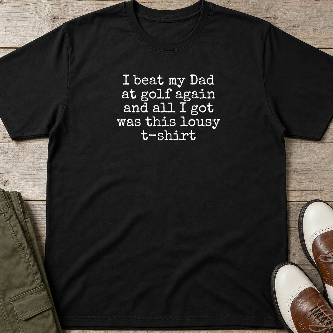 Beat My Dad T-Shirt in Black lying on a plain floor. T-shirt is a unisex cut and 100 per cent cotton.