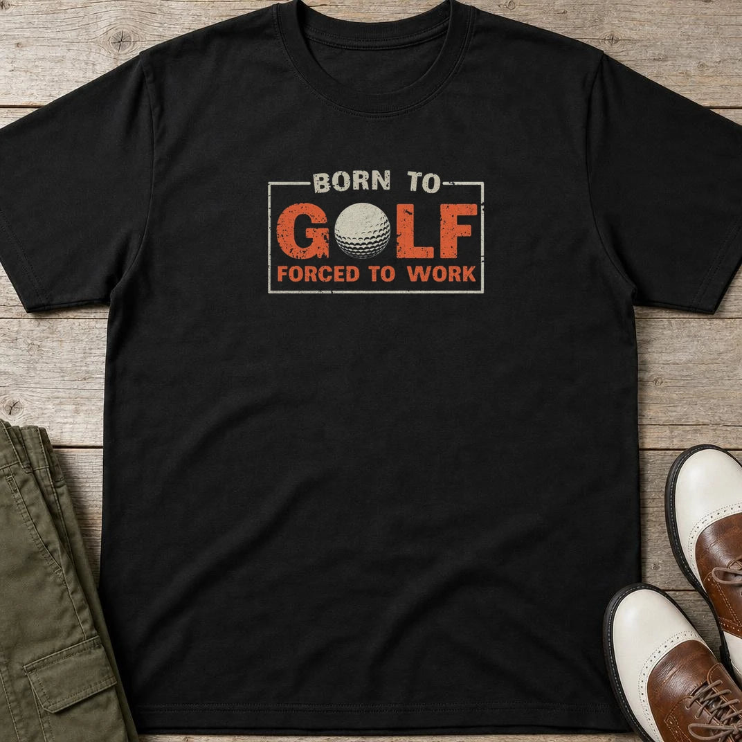 Born Golf T-Shirt in lying on a plain floor. T-shirt is a unisex cut and 100 per cent cotton.