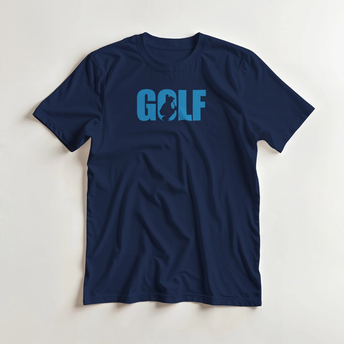 Golf C T-Shirt in Navy lying on a plain floor. T-shirt is a unisex cut and 100 per cent cotton.