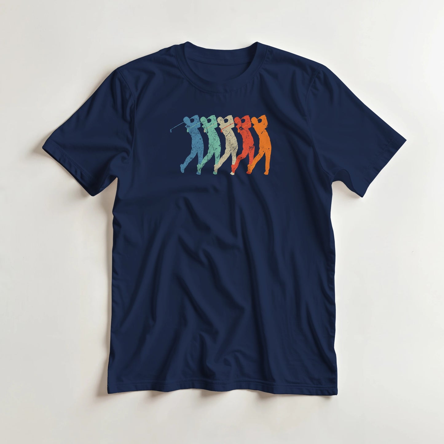 Golf Swing T-Shirt in Navy lying on a plain floor. T-shirt is a unisex cut and 100 per cent cotton.