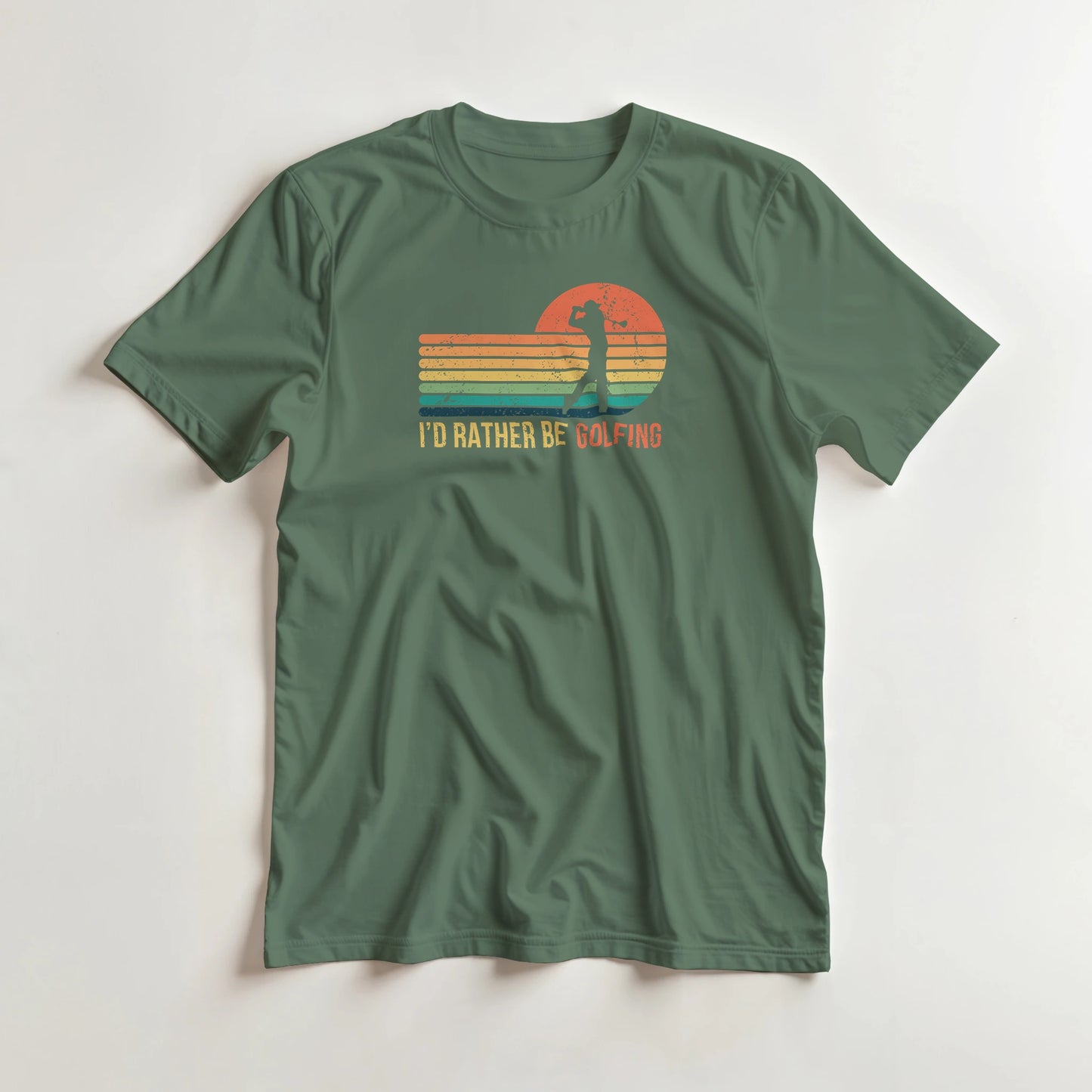 Rather Be Golfing T-Shirt in Military Green 2XL lying on a plain floor. T-shirt is a unisex cut and 100 per cent cotton.
