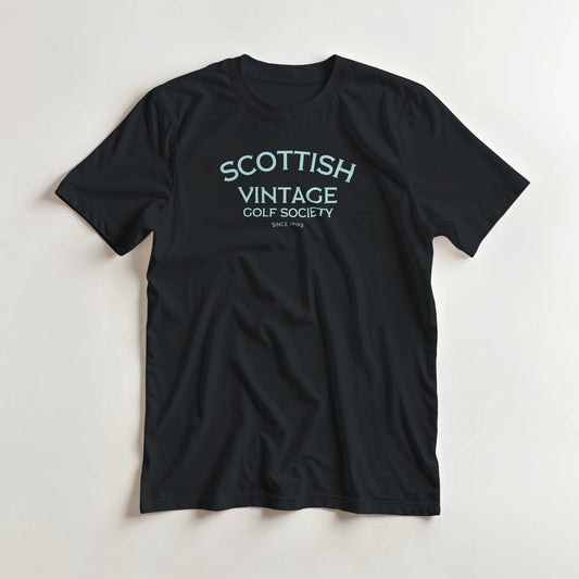 Scottish 1903 T-Shirt in Black lying on a plain floor. T-shirt is a unisex cut and 100 per cent cotton.