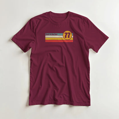 Duel Sun T-Shirt in Maroon 3XL lying on a plain floor. T-shirt is a unisex cut and 100 per cent cotton.