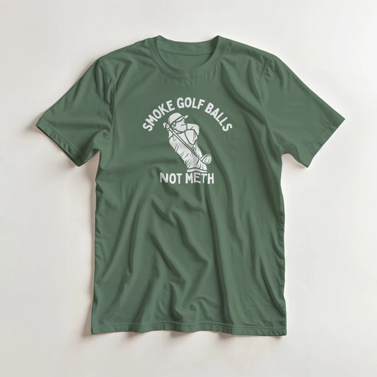 Smoke Golf Balls T-Shirt in Military Green lying on a plain floor. T-shirt is a unisex cut and 100 per cent cotton.