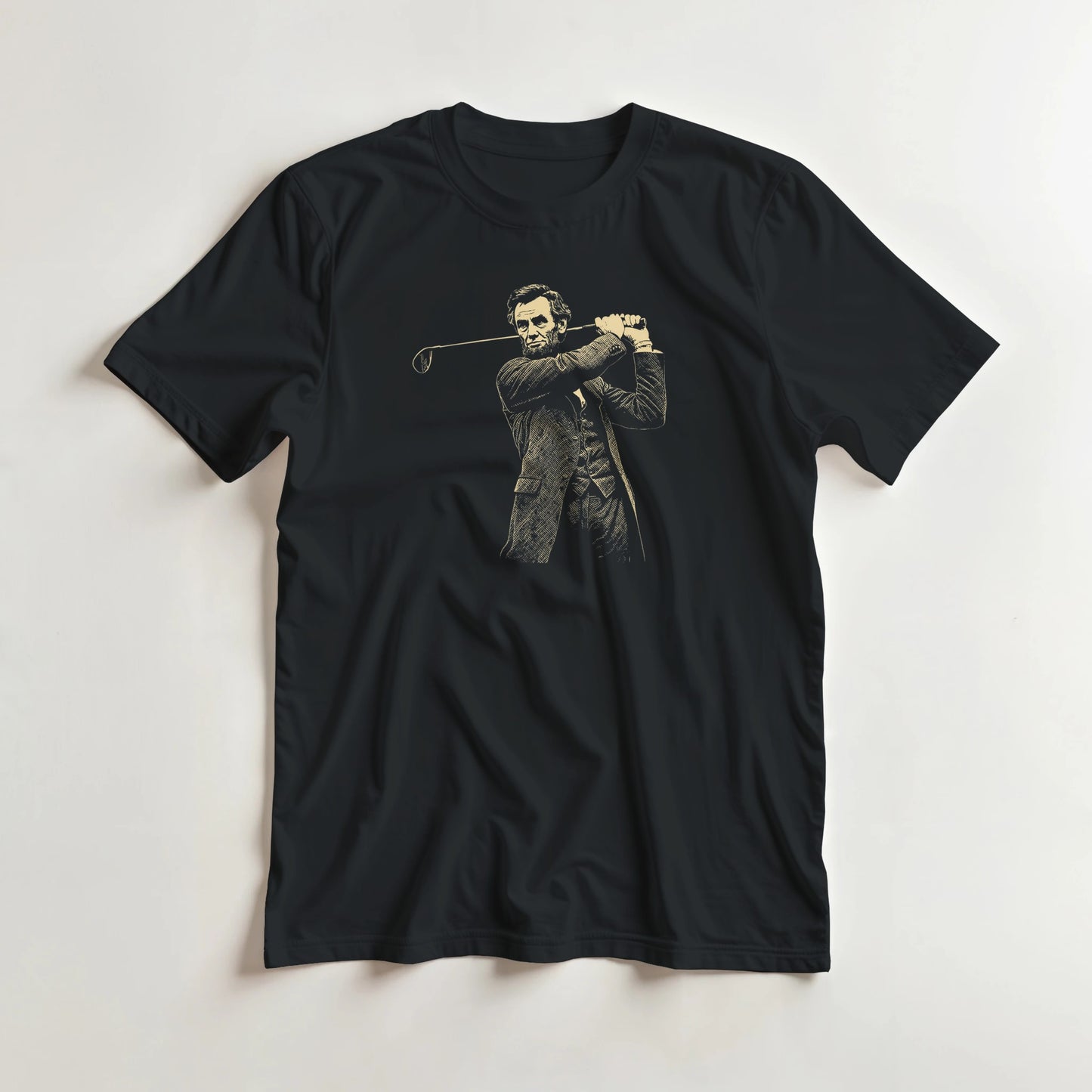 Lincoln On Course T-Shirt in Black lying on a plain floor. T-shirt is a unisex cut and 100 per cent cotton.