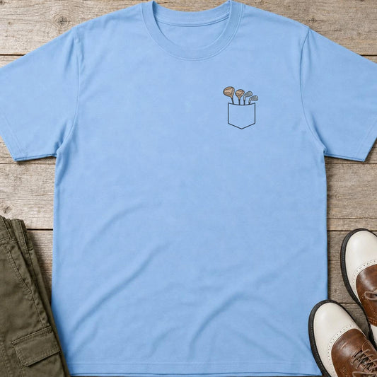 Club Pocket T-Shirt in Light Blue lying on a plain floor. T-shirt is a unisex cut and 100 per cent cotton.