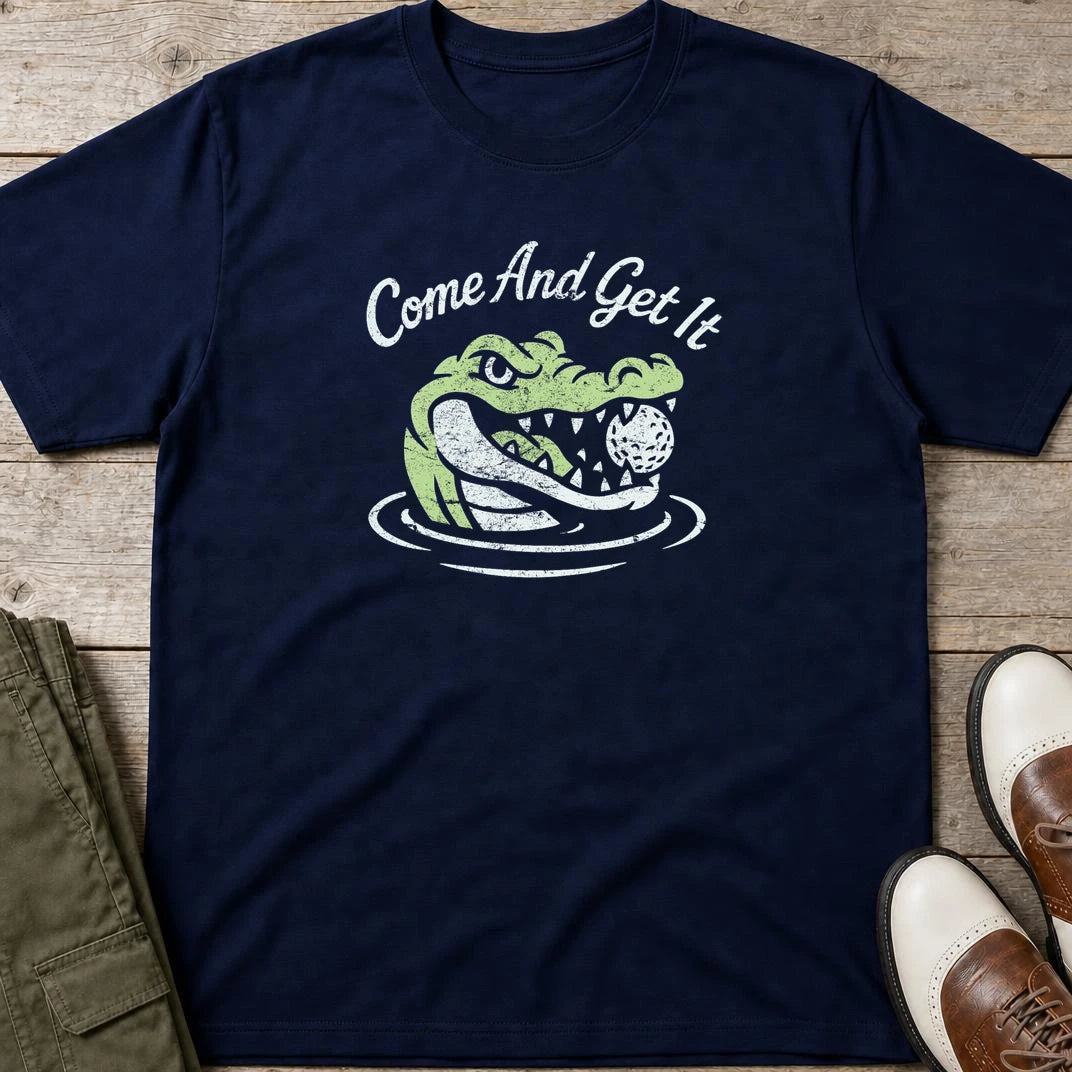 Come And Get It T-Shirt in Navy lying on a plain floor. T-shirt is a unisex cut and 100 per cent cotton.