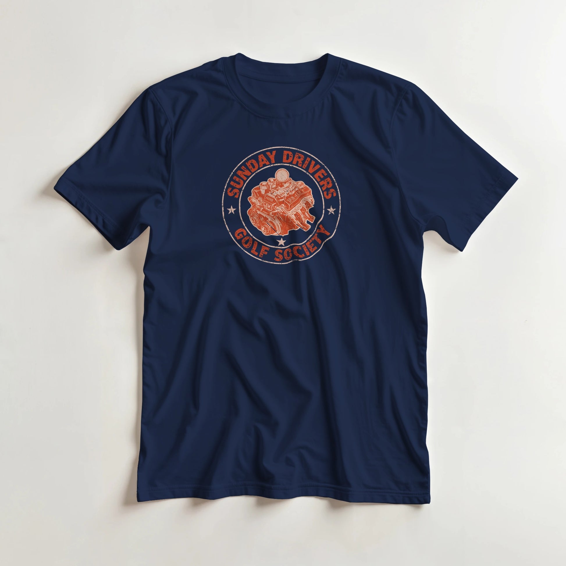 Sunday Drivers T-Shirt in Navy lying on a plain floor. T-shirt is a unisex cut and 100 per cent cotton.