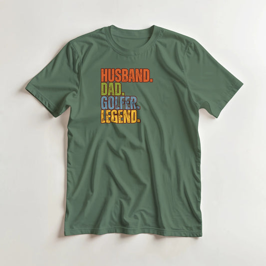 Husband Dad T-Shirt in Military Green lying on a plain floor. T-shirt is a unisex cut and 100 per cent cotton.