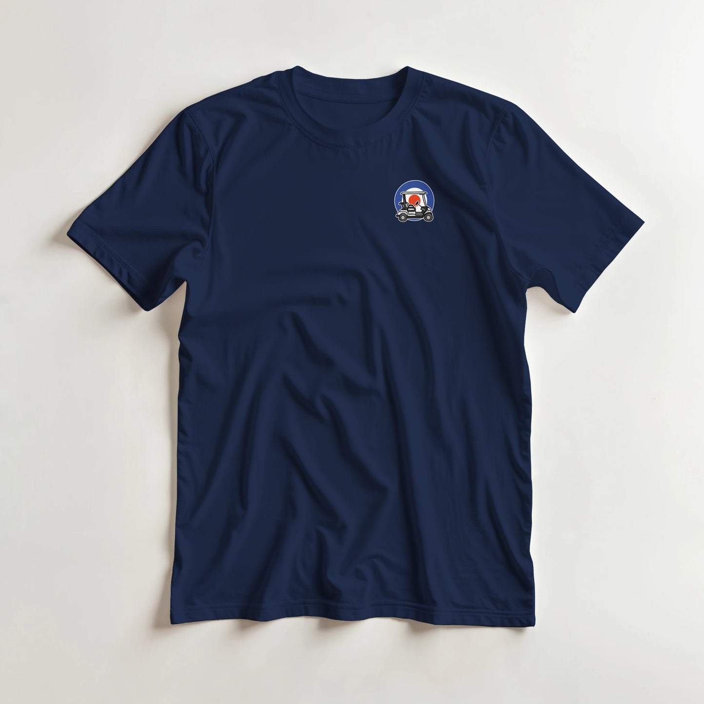 Mod Cart Pocket T-Shirt in Navy S lying on a plain floor. T-shirt is a unisex cut and 100 per cent cotton.
