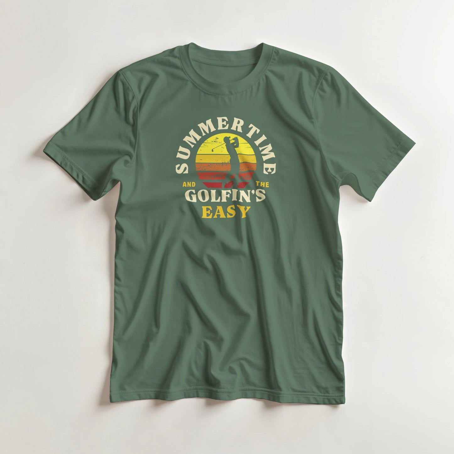Summertime T-Shirt in Military Green lying on a plain floor. T-shirt is a unisex cut and 100 per cent cotton.