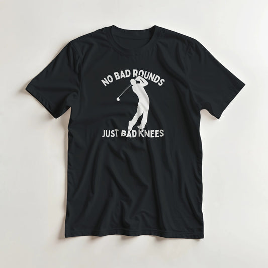 Bad Knees T-Shirt in Black lying on a plain floor. T-shirt is a unisex cut and 100 per cent cotton.