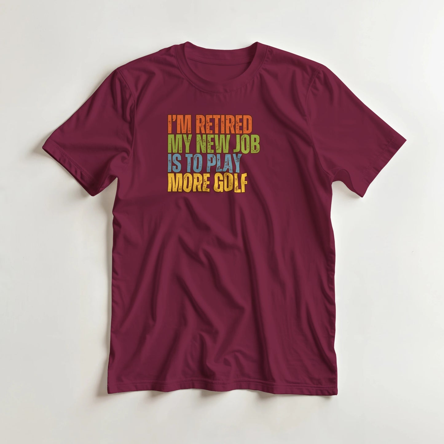 I'm Retired T-Shirt in Maroon 3XL lying on a plain floor. T-shirt is a unisex cut and 100 per cent cotton.