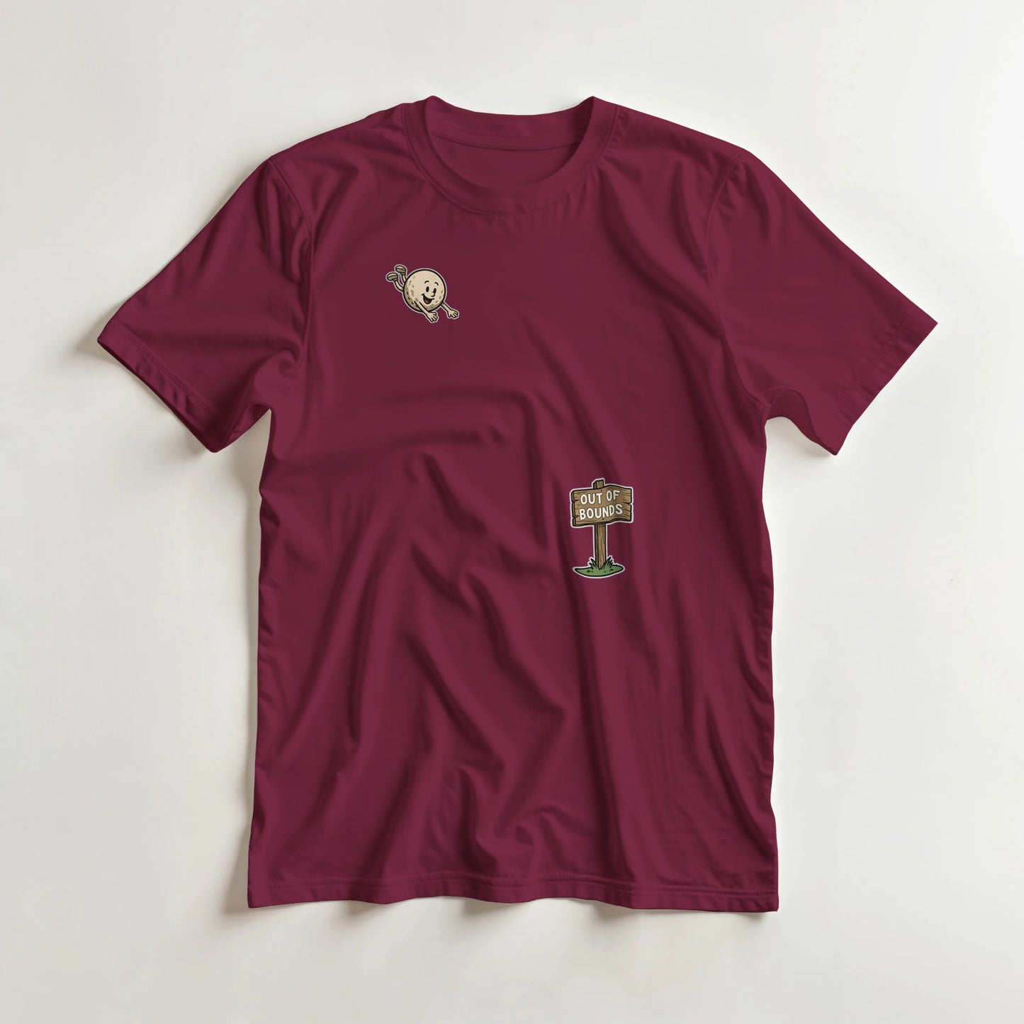 Flying Out Of Bounds T-Shirt in Maroon lying on a plain floor. T-shirt is a unisex cut and 100 per cent cotton.