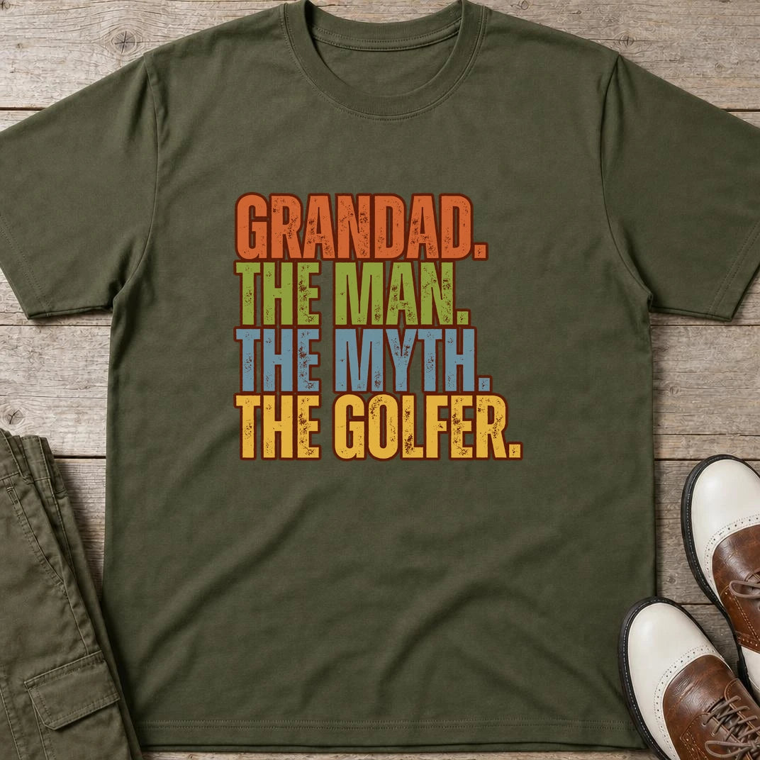 Grandad Golfer T-Shirt in Military Green lying on a plain floor. T-shirt is a unisex cut and 100 per cent cotton.
