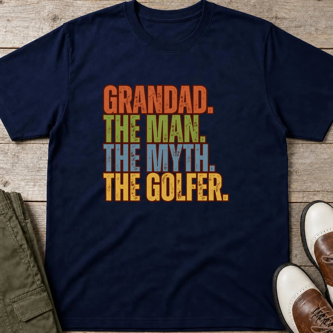 Grandad Golfer T-Shirt in Navy lying on a plain floor. T-shirt is a unisex cut and 100 per cent cotton.
