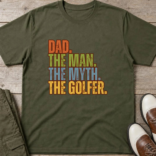 Dad The Legend Golfer T-Shirt in Military Green lying on a plain floor. T-shirt is a unisex cut and 100 per cent cotton.