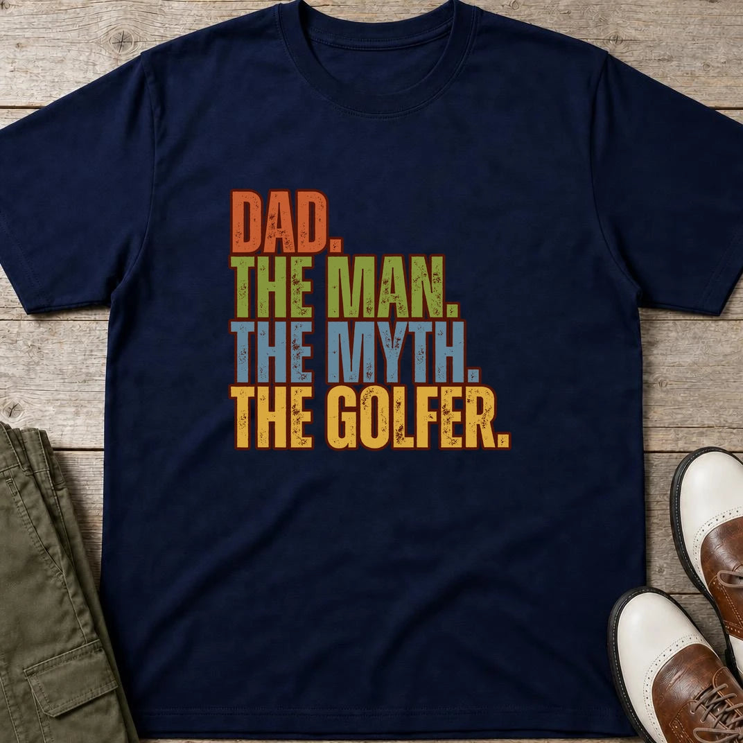 Dad The Legend Golfer T-Shirt in Navy lying on a plain floor. T-shirt is a unisex cut and 100 per cent cotton.