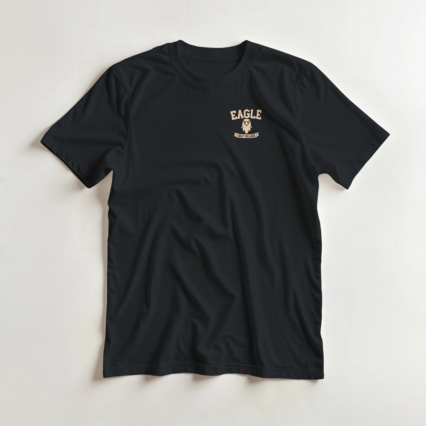 Eagle College (Pocket) T-Shirt in Black lying on a plain floor. T-shirt is a unisex cut and 100 per cent cotton.