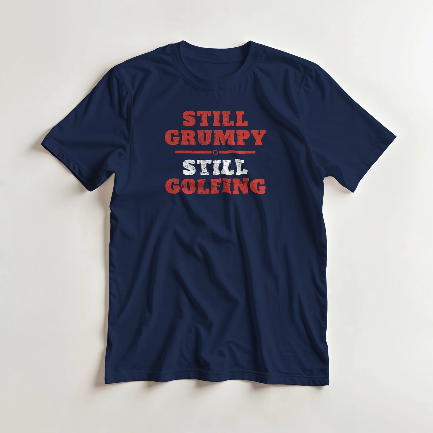 Still Grumpy Red T-Shirt in Navy 2XL lying on a plain floor. T-shirt is a unisex cut and 100 per cent cotton.