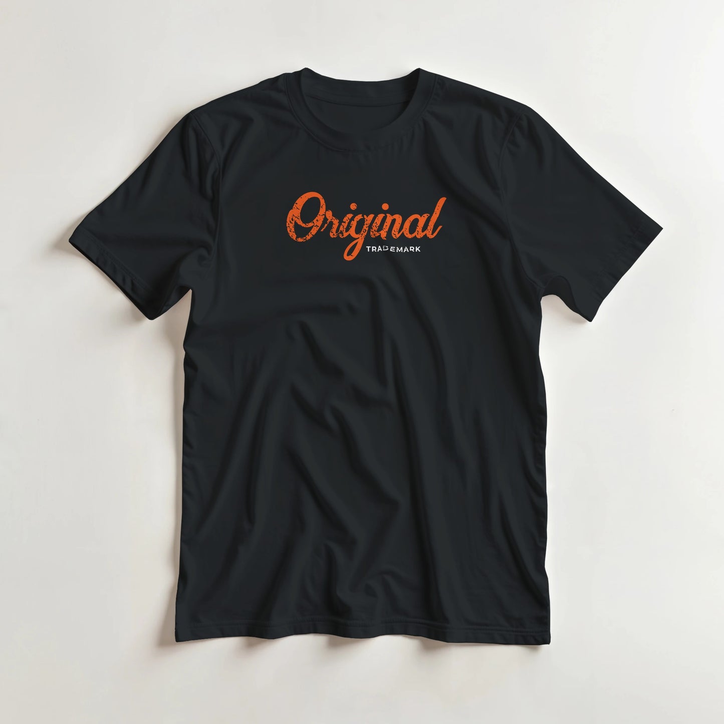 Original T-Shirt in Black M lying on a plain floor. T-shirt is a unisex cut and 100 per cent cotton.