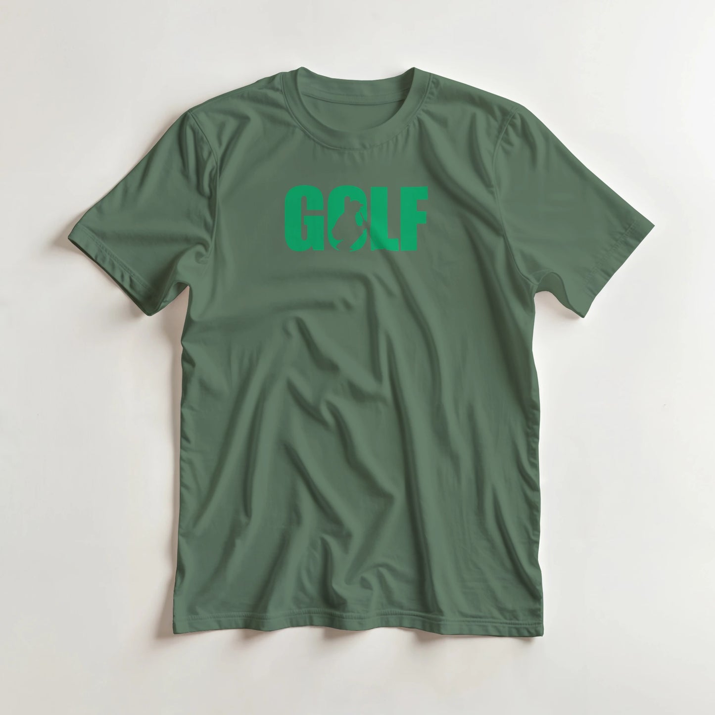 Golf C T-Shirt in Military Green lying on a plain floor. T-shirt is a unisex cut and 100 per cent cotton.