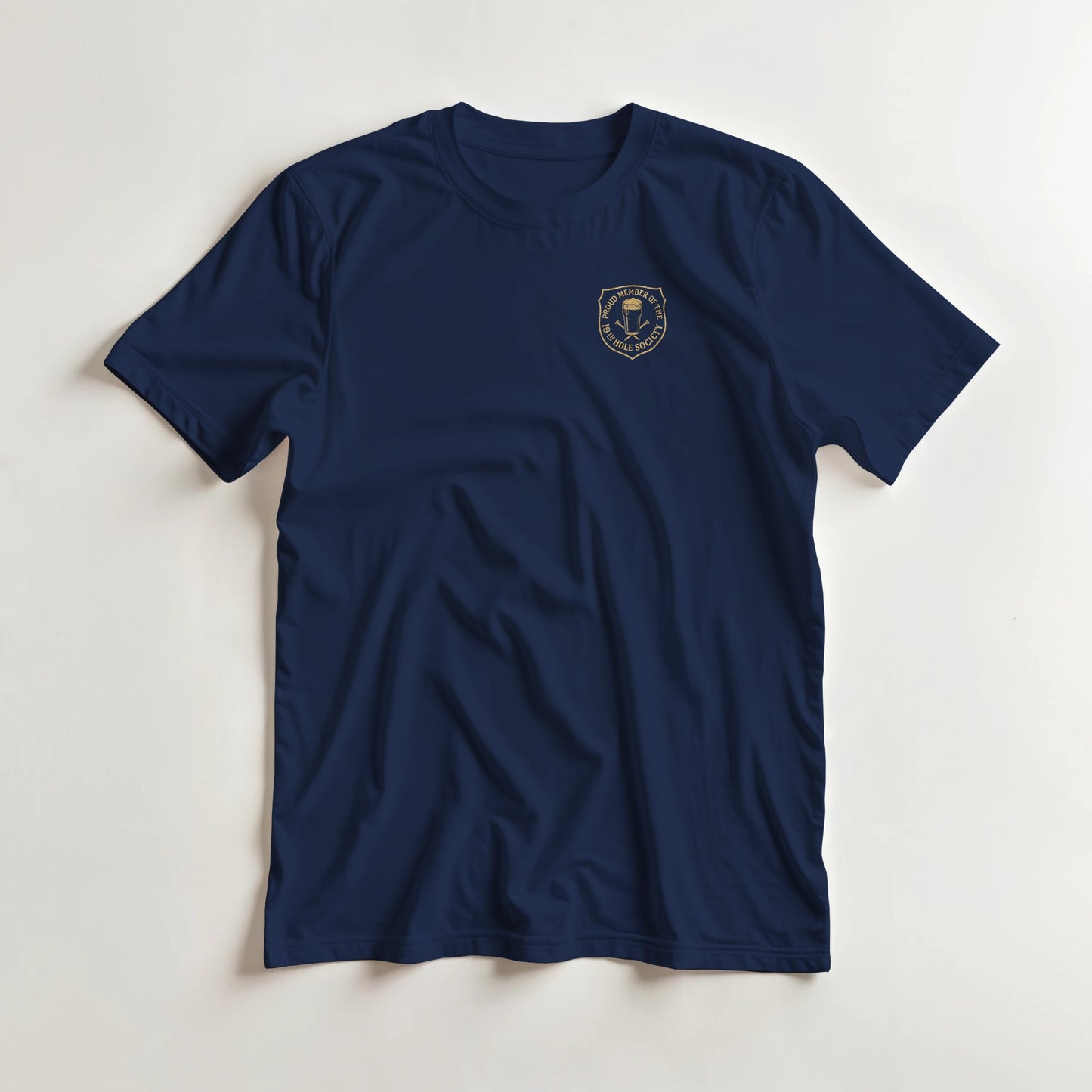 19th Hole T-Shirt in Navy S lying on a plain floor. T-shirt is a unisex cut and 100 per cent cotton.