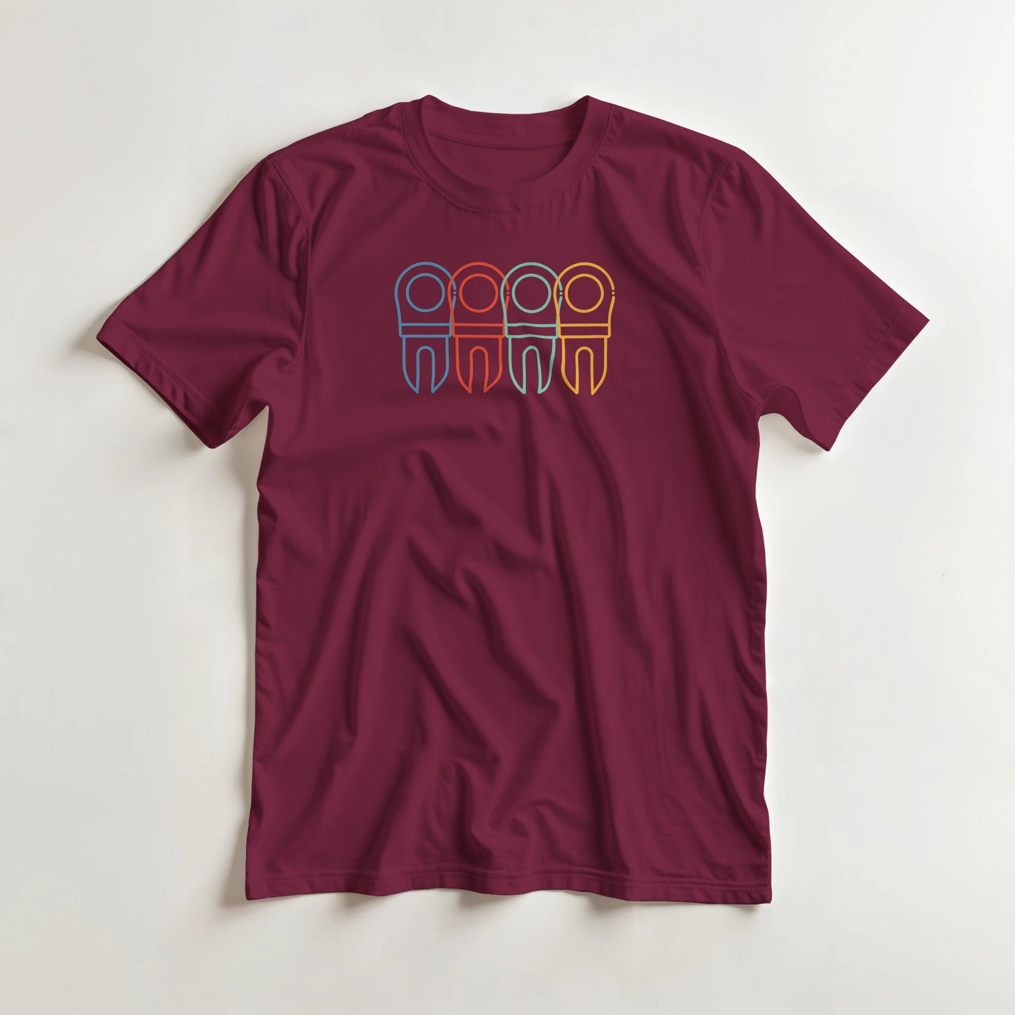 Divot Rainbow T-Shirt in Maroon XL lying on a plain floor. T-shirt is a unisex cut and 100 per cent cotton.