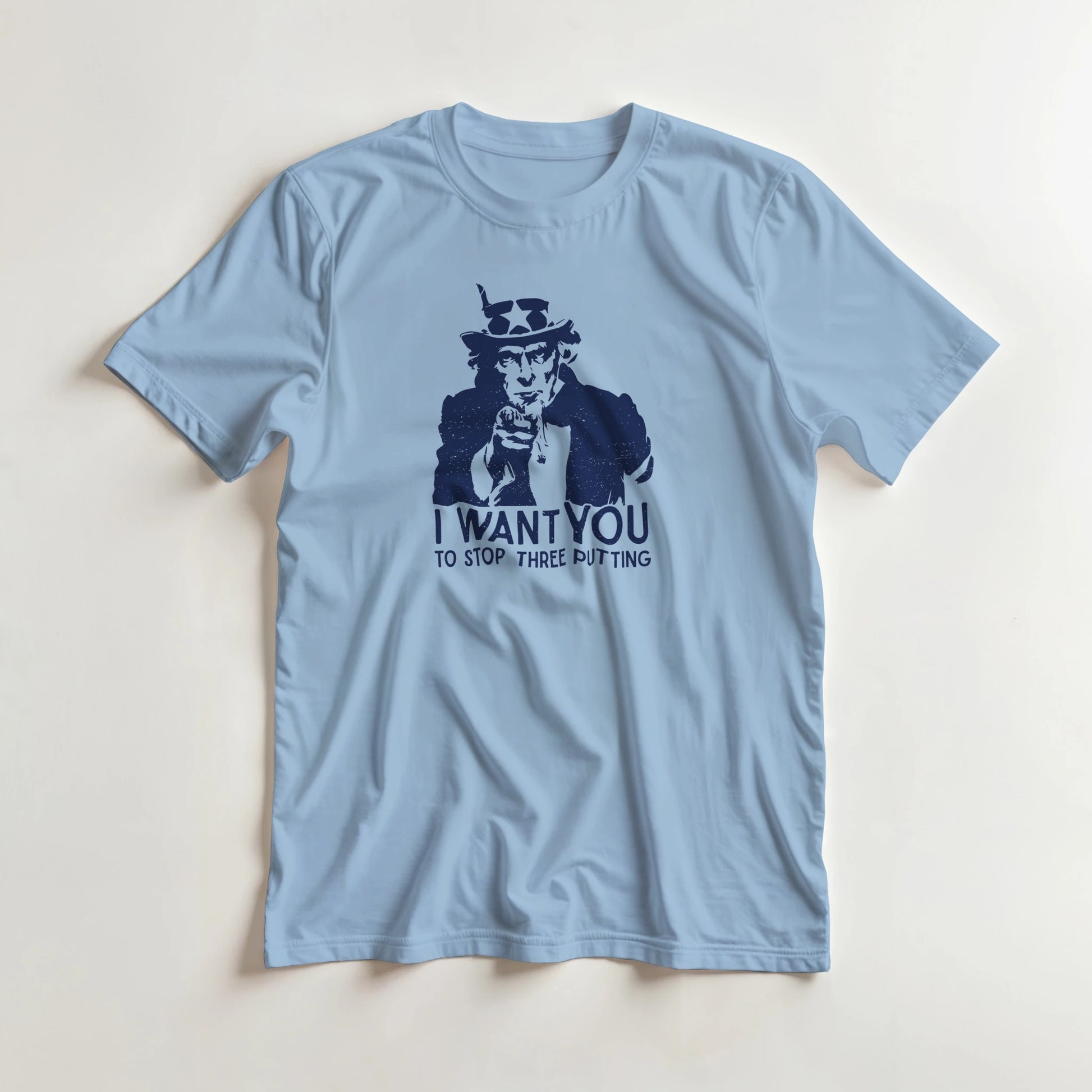 I Want You T-Shirt in Light Blue lying on a plain floor. T-shirt is a unisex cut and 100 per cent cotton.
