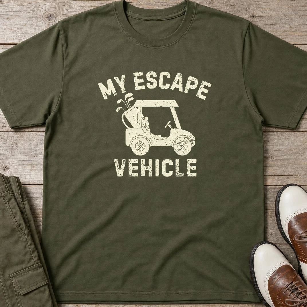 Escape Vehicle T-Shirt in Military Green lying on a plain floor. T-shirt is a unisex cut and 100 per cent cotton.