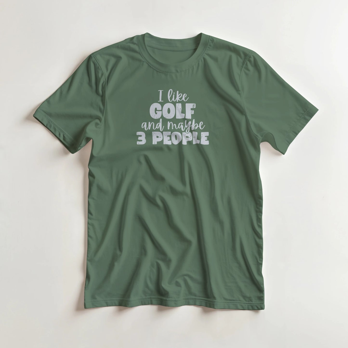 I Like Golf T-Shirt in Military Green M lying on a plain floor. T-shirt is a unisex cut and 100 per cent cotton.