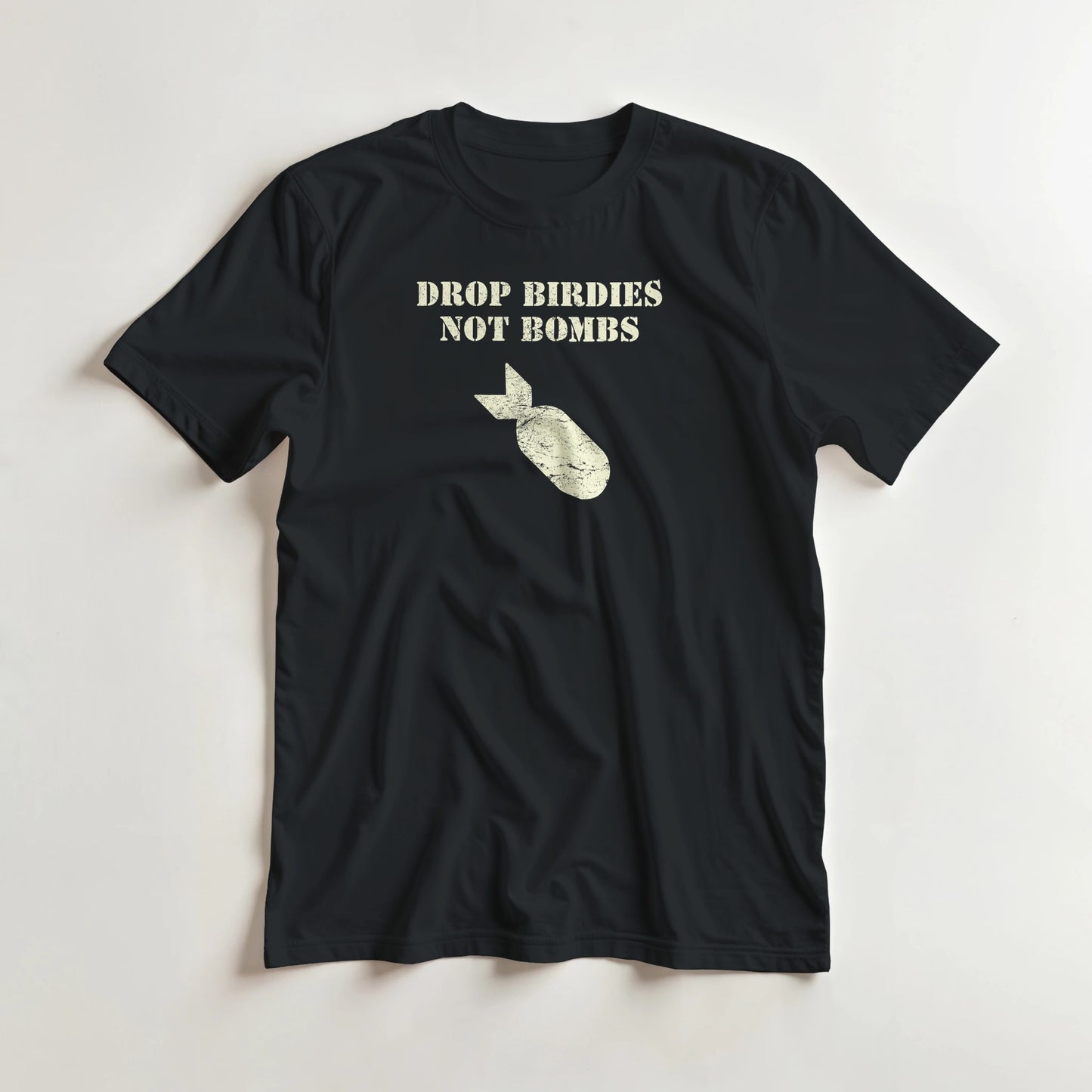 Drop Birdies T-Shirt in Black L lying on a plain floor. T-shirt is a unisex cut and 100 per cent cotton.