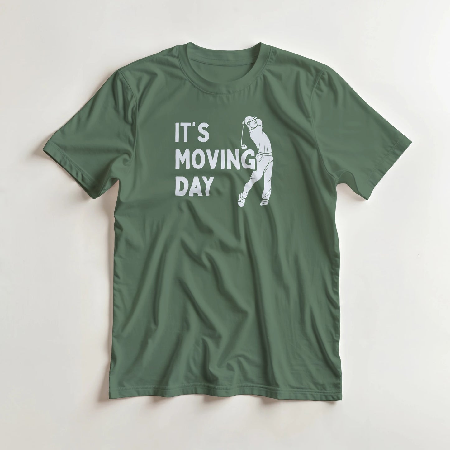 Moving Day T-Shirt in Military Green 3XL lying on a plain floor. T-shirt is a unisex cut and 100 per cent cotton.