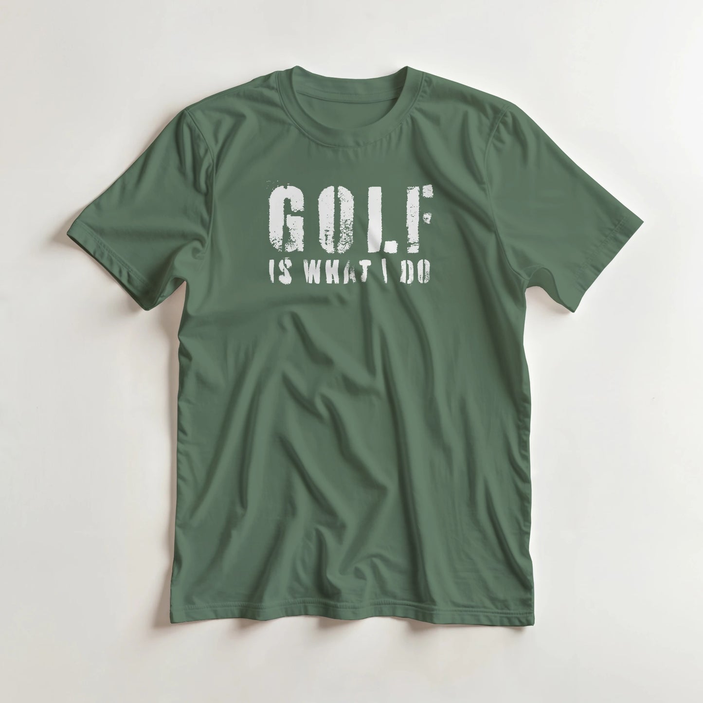 What I Do T-Shirt in Military Green lying on a plain floor. T-shirt is a unisex cut and 100 per cent cotton.
