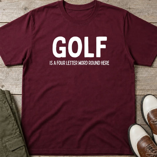 Four Letter Word T-Shirt in Maroon lying on a plain floor. T-shirt is a unisex cut and 100 per cent cotton.
