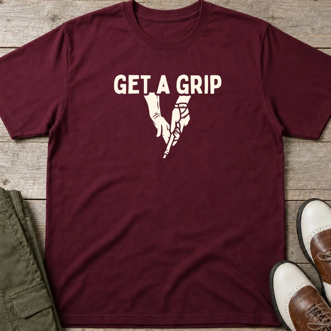 Get A Grip T-Shirt in Maroon lying on a plain floor. T-shirt is a unisex cut and 100 per cent cotton.